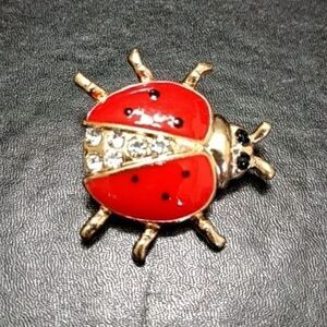 Gold tone and red enamel ladybug pin brooch